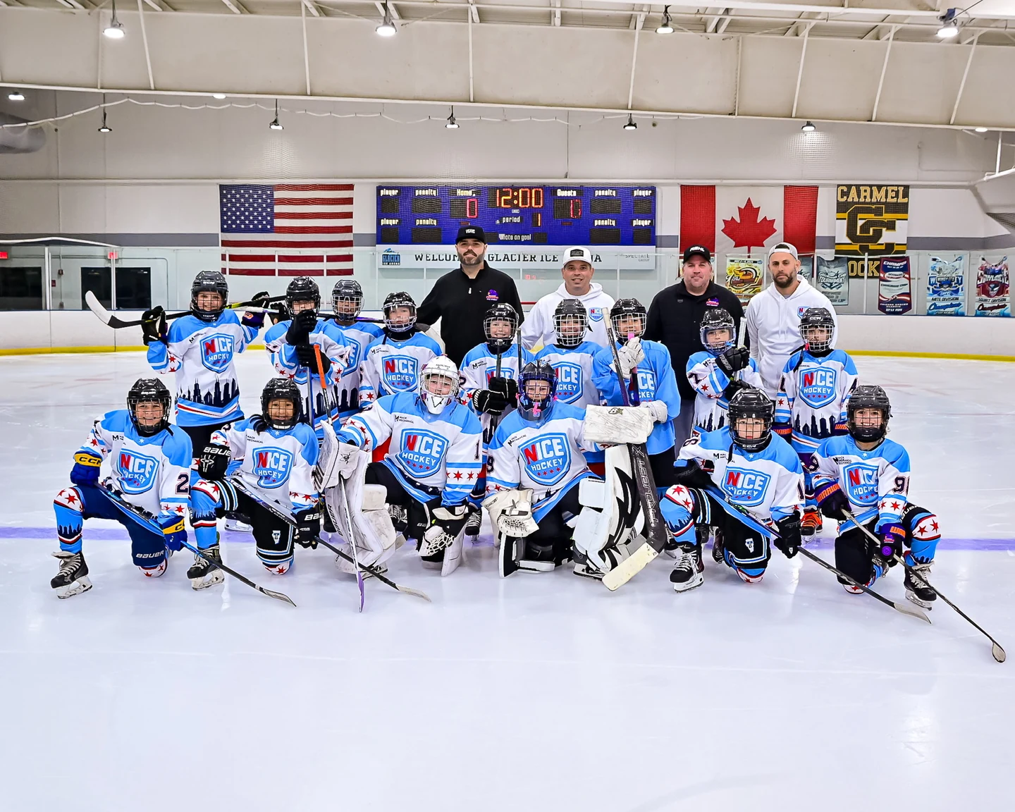 NICE Hockey players and coaches posing together on the ice